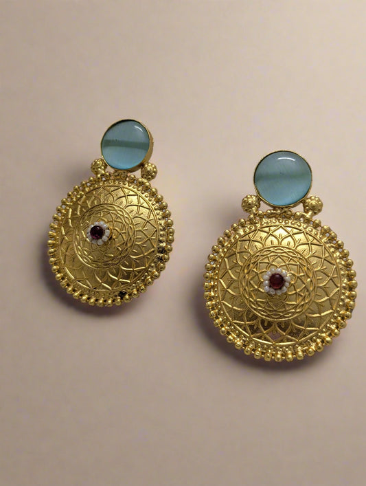 Gold earrings with blue stones