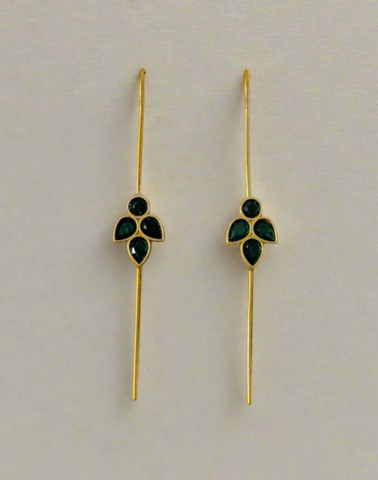 Gold earrings with green gemstones